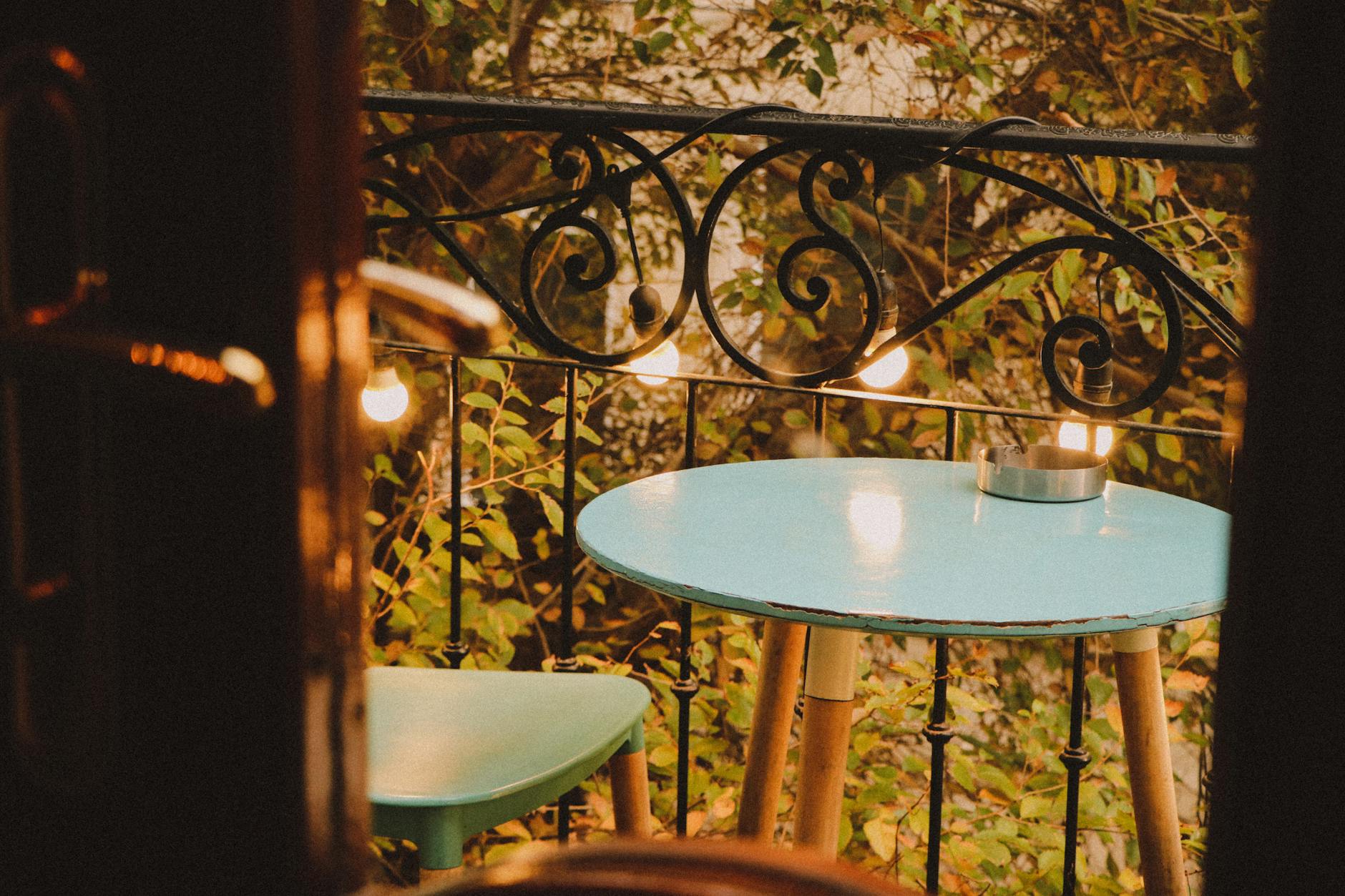 yellow light bulbs hanging on metal railing